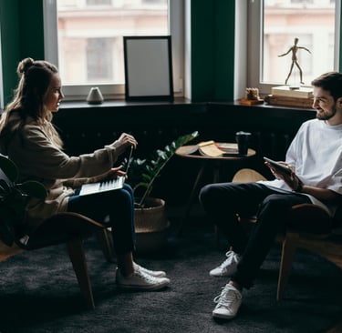 Therapist providing trauma-focused therapy session using CBT, mindfulness, and IFS approaches Trauma