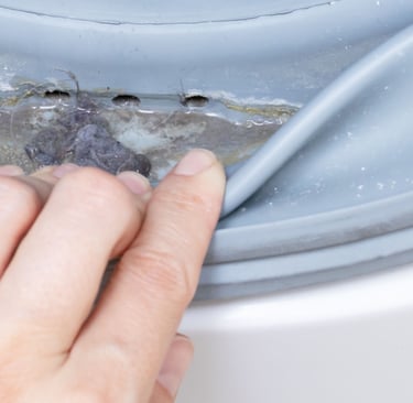 a person's hand is touching a piece of metal