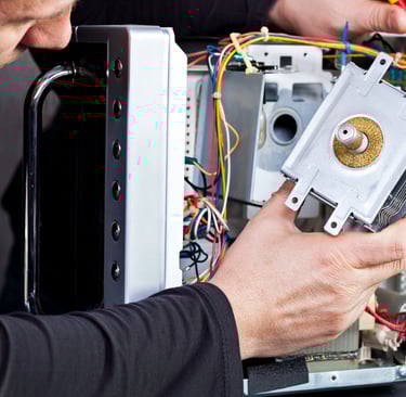 a man is fixing a computer monitor in a computer