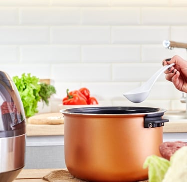 a person is cooking in a potted potted with a spoon