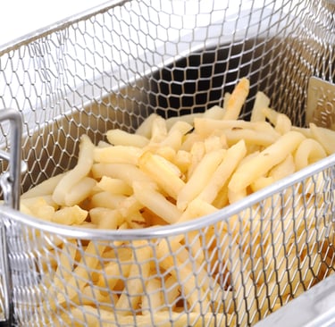 a basket of fries with fries on top of it
