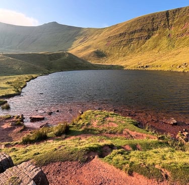 Brecon Beacons dramatic lake autumn coloured forests 