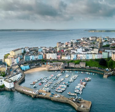 Tenby Harbour Pembrokeshire sunny cheerful with colourful boats 