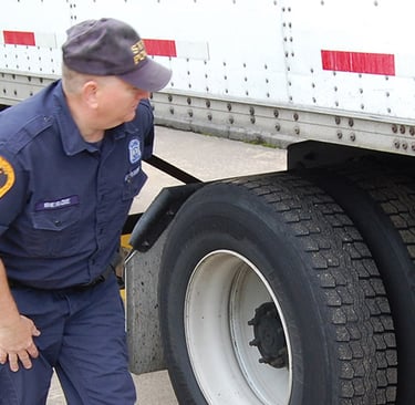 FMCSA auditor examining carrier compliance documents during safety review.