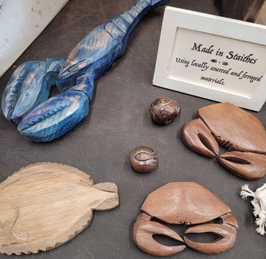 Carved lobster and crabs by Jack Iredale