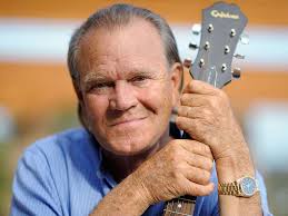 Glen Campbell holding a guitar