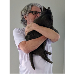 Greg Rowland holding his ESA cat, Big Bit.