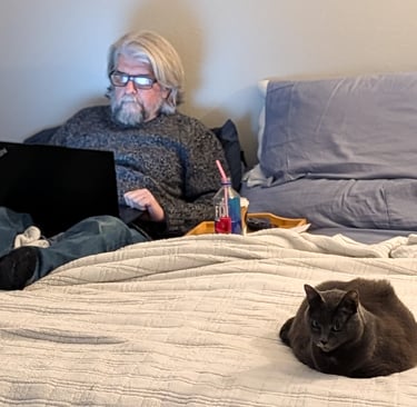 Greg Rowland with his cat Big Bit