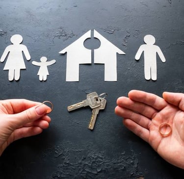 a person holding a keychaik and a house shaped paper cutout of a