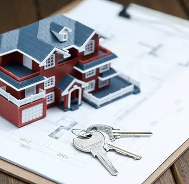 a house with keys and keys in front of a clipboard
