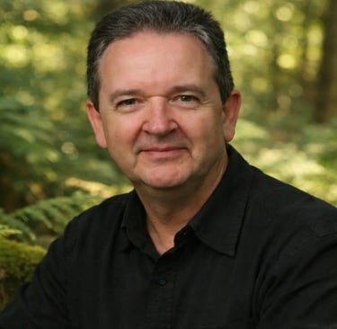 Bruce Clifton spiritual author founder of The Spiritual Centre photographed in woodland natural light