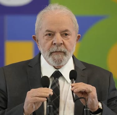 a man in a suit and tie is speaking into a microphone