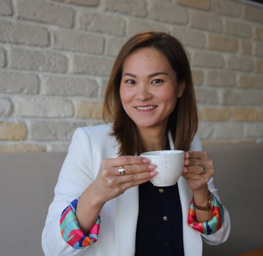 a japanese woman in a white jacket and colorful bracelets