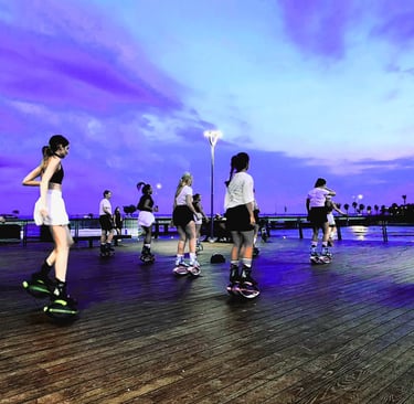 a group of women kangoo jump in KLCC