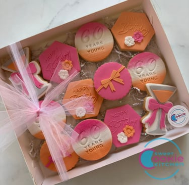 12 cookie gift box for 60th birthday, pink orange white theme.