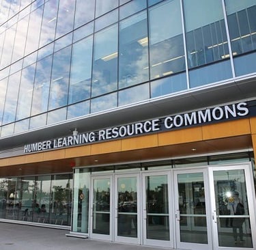 Exterior of Humber College with glass doors and entrance sign, symbolizing a gateway to global