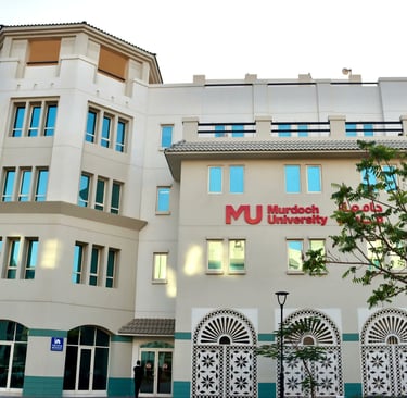 Exterior view of Murdoch University Dubai with arched windows, highlighting the institution