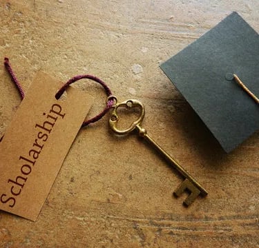 Golden key with graduation cap and tag, representing USIEF's commitment to educational opportunities