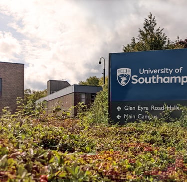 University of Southampton signboard with buildings and greenery in the backgroun