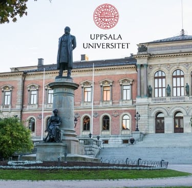 Uppsala University building with a statue in the foreground, representing the historic significance