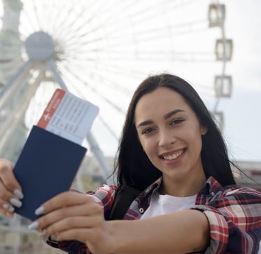 Woman holding passport and boarding pass, representing readiness for international education & visa
