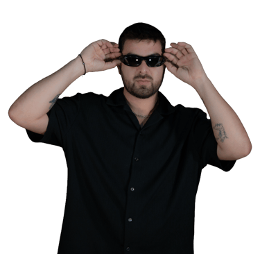 Memo Pearls, Puerto Vallarta DJ and founder of The Door, adjusting sunglasses during a photoshoot