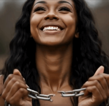 A female holing broken chains and smiling