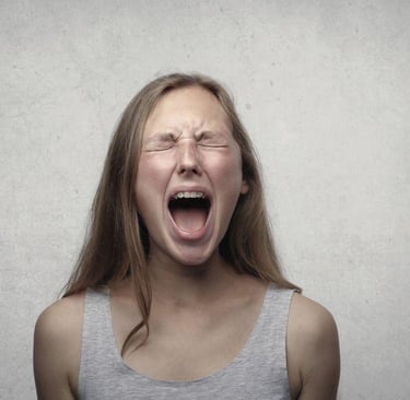 a woman screaming in fear