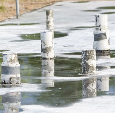 utility pipes running through concrete slab