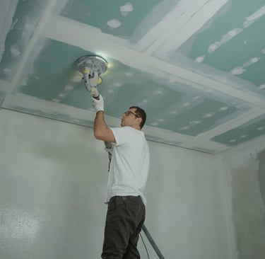electric drywall sander with vacuum attached