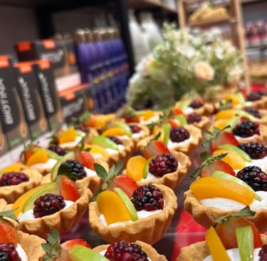 a variety of desserts on display in a store
