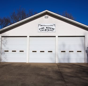 A fire station with 3 garage doors
