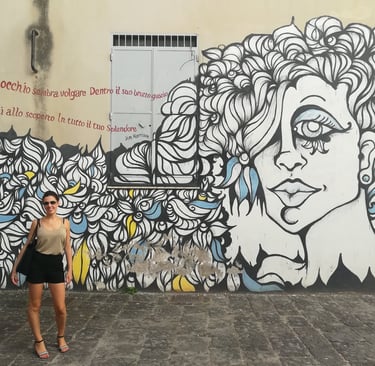 Giusy in front of the Jim Morrison mural in Fornelle, Salerno.