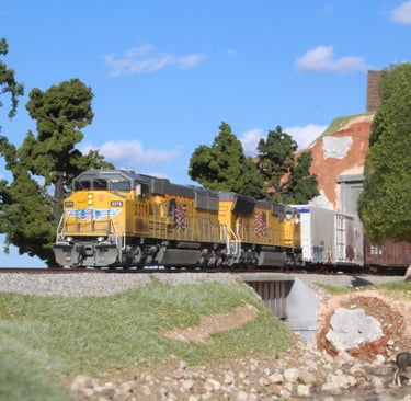 HO Scale model trains on outdoor diorama