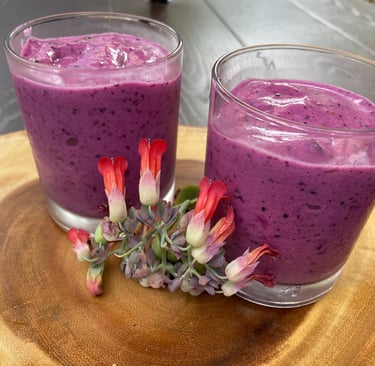 two glasses of dragon fruit blueberry smoothie