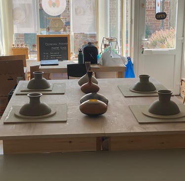 A selection of pots made on a a sectional wheel throwing course in Bristol
