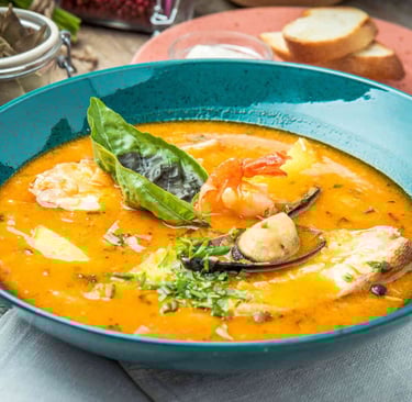 A traditional bouillabaisse served in Marseille, made with fresh Mediterranean fish and saffron brot