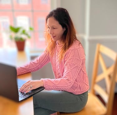 Dr. Nicole Rowe working at computer