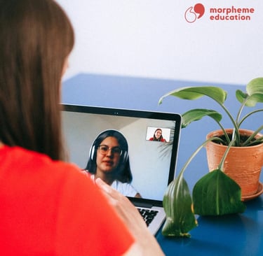 woman studying online with a plant on the table