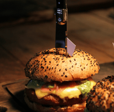 Photo by Michael Wave https://www.pexels.com/photo/close-up-shot-of-two-delicious-hamburgers-on-wooden-chopping-boards-430041