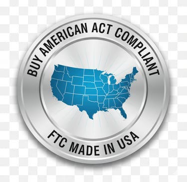 Metallic badge reading “Buy American Act Compliant” and “FTC Made in USA,” symbolizing full domestic