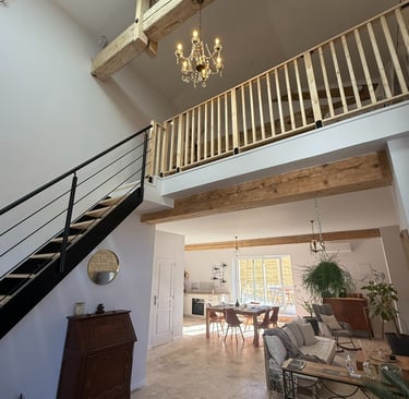a living room with a staircase and a staircase