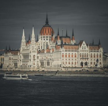 Hungarian Parliament building in Budapest along the Danube River at sunset