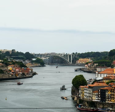Colorful buildings along Douro River in Porto, Portugal with historic skyline