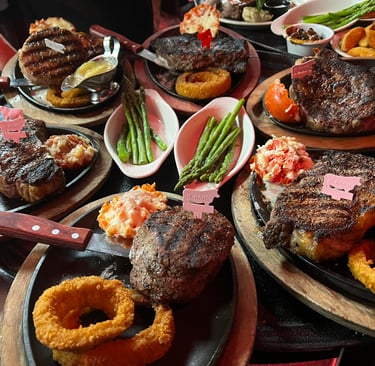 a table with plates of food and a knife and fork