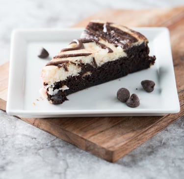 a slice of cake with chocolate chips and chocolate chips