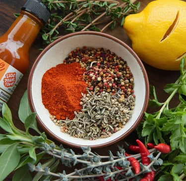a bowl of spices and herbs on a table