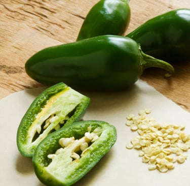 some peppers on a cutting board