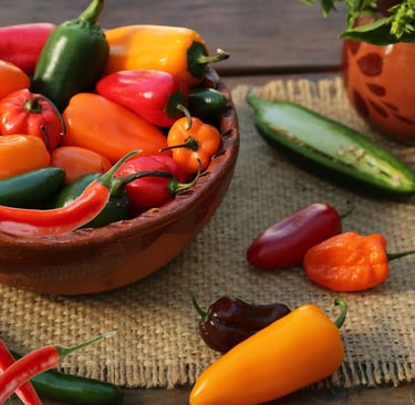 a bowl of peppers on a table