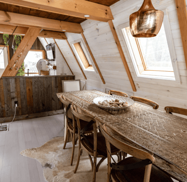 a wooden table with a wooden table and chairs